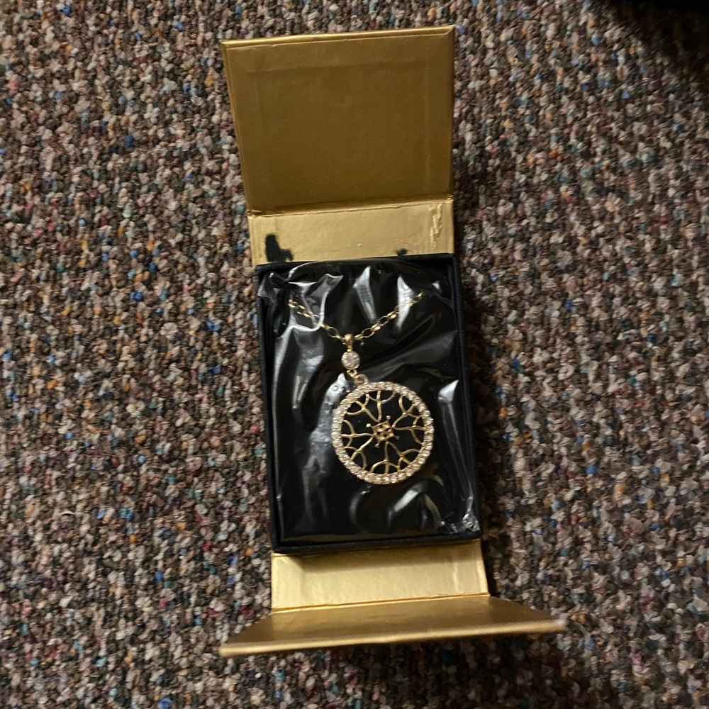 Avon Gold and Silver Wheel Pendant Necklace